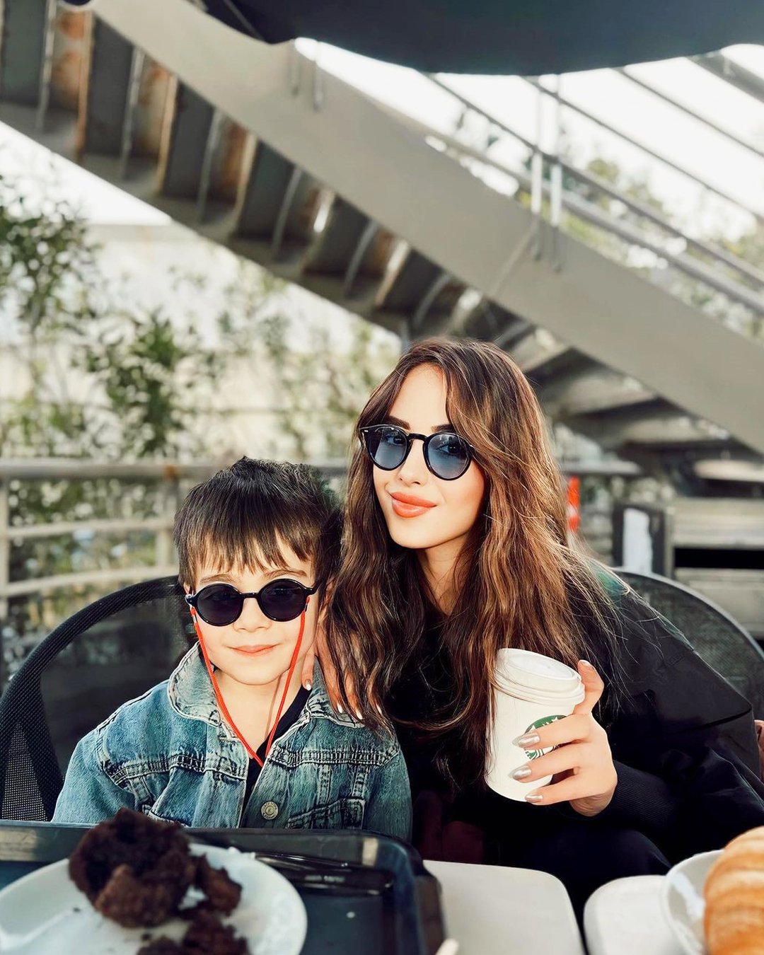 Family wearing Looklight children's sunglasses outdoors